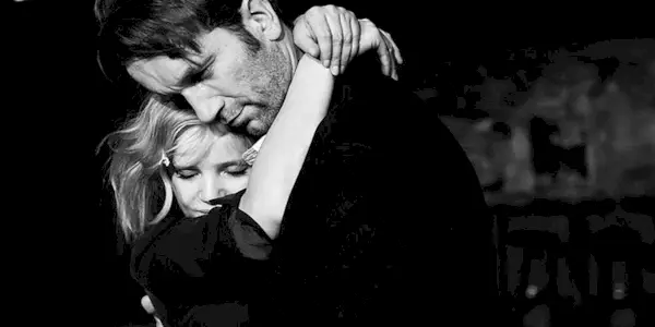 Zula and Wiktor embracing in Cold War.