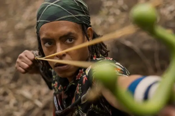 Usopp in One Piece pulling back a slingshot