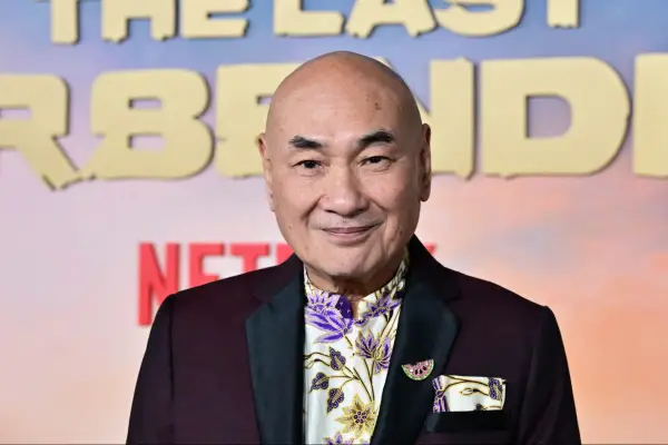 Lim Kay Siu wearing a burgundy blazer and flowery top