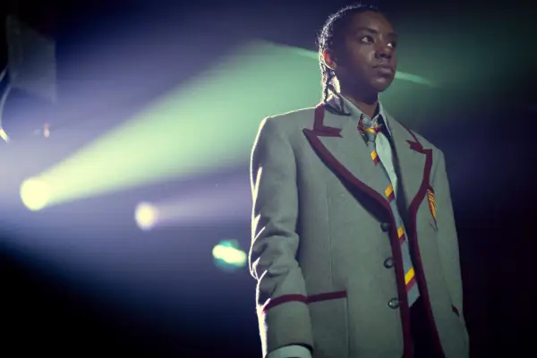 Dua Saleh as Cal in Episode 7 of Sex Education Season 3 wearing grey school uniform