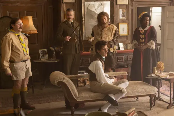 Pat (Jim Howick), The Captain (Ben Willbond), Thomas Thorne (Mathew Baynton), Robin (Larry Rickard) and Kitty (Lolly Adefope) standing together in Button House in Ghosts