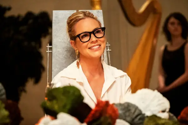 Jordan sat at a table at a dinner party, smiling