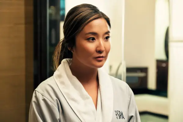 Naomi dressed in a white robe