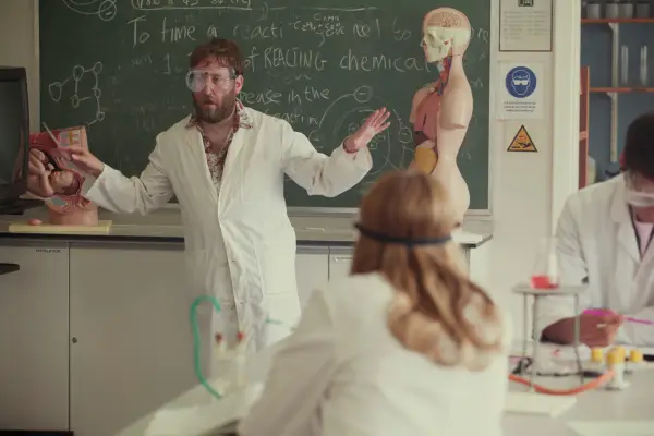 Jim Howick plays Mr Hendricks in Sex Education Season 1 wearing a lab coat