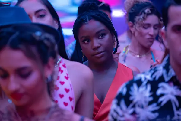 Courtney Taylor as Mia in Neon standing in a crowd