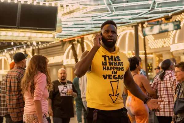 Trunk standing in a casino talking on the phone