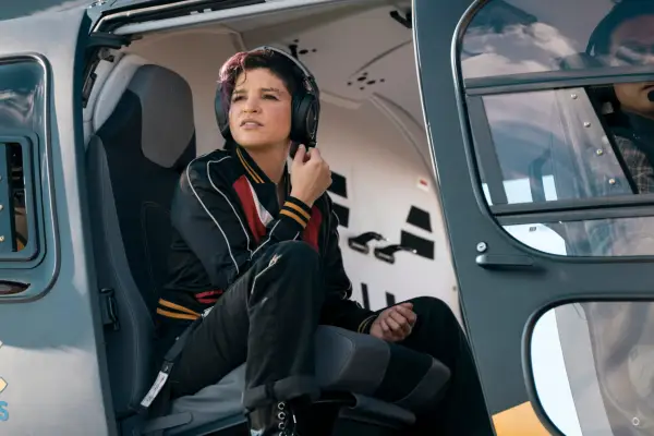 Angela sat in a helicopter with the door open