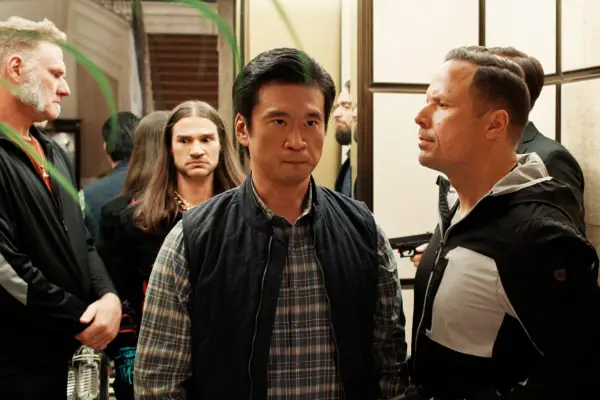 Paul stood with a group of men behind him, he looks angry