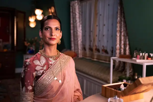 Nalini stood in her living room wearing a sari with her hair pulled back