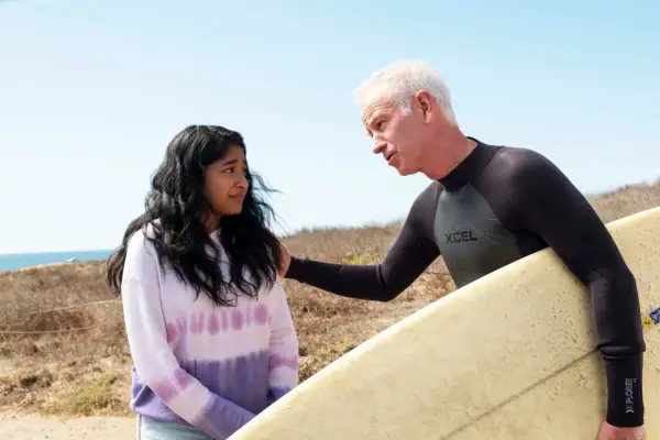 JOHN McENROE with his hand on Devi