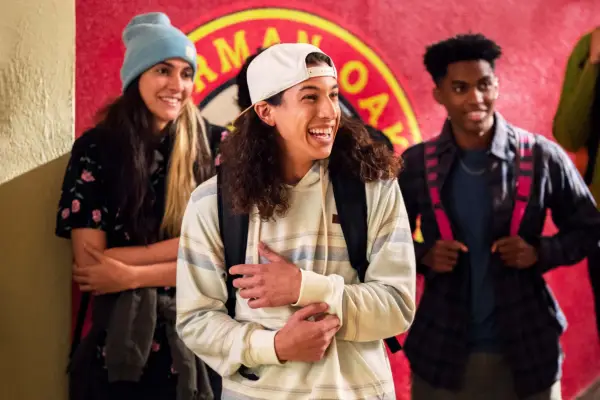 Trent stood with friends in the school hallway laughing