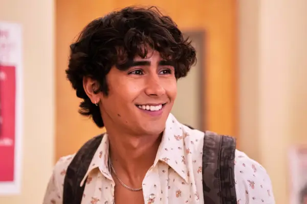 Ethan smiling while stood in the school hallway