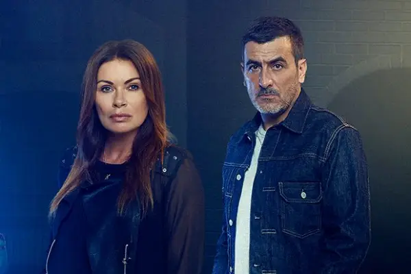 Alison King as Carla Barlow and Chris Gascoigne as Peter Barlow pose for Coronation Street, staring into camera