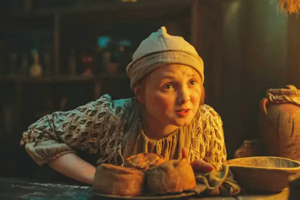 Little Karen sat at a table, talking to someone