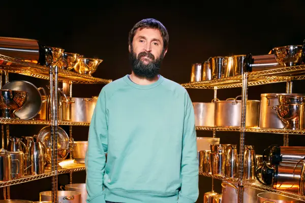 Eliza Bean wearing period dress, smiling, standing in a group