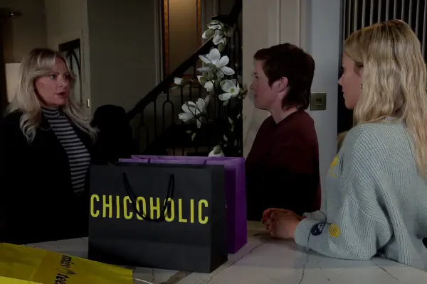 Lisa catching Becky and Betsy with shopping bags in Coronation Street