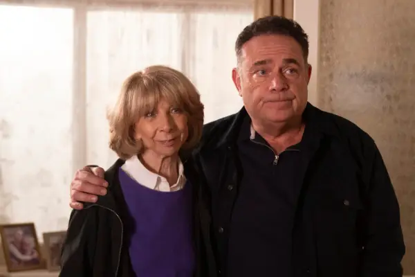 Jesse and Gail hugging and looking awkward