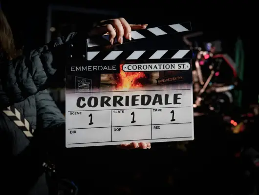 A clapperboard with the word Corriedale emblazoned in bold across it.