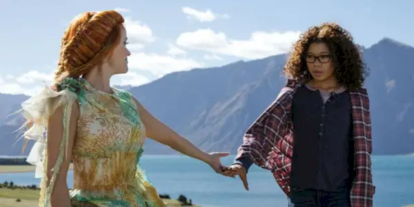 Two actors holding hands in Wrinkle in Time.