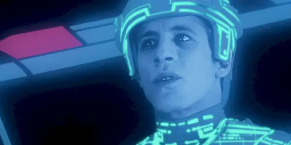 A character shining in a blue light in Tron.