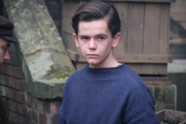 Oaklee Pendergast as teenage Archie in Archie wearing a blue jumper
