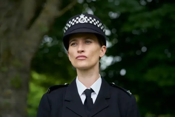 Charley Webb as WPC Anna Lawson in The Long Shadow wearing a black police uniform