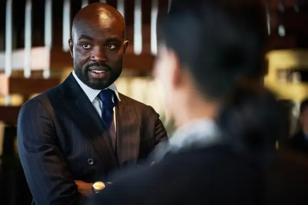 alex standing with his arms crossed