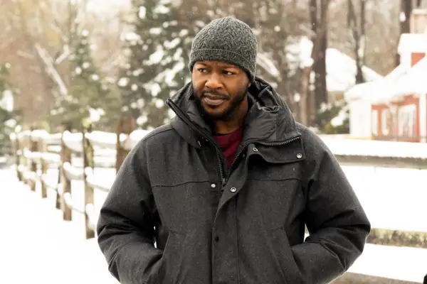 Edwin Hodge as Special Agent Ray Cannon standing outside in the snow