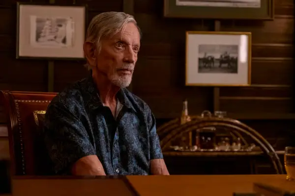 Scott Glenn seated behind a desk as Jim Hollinger in The White Lotus season 3.