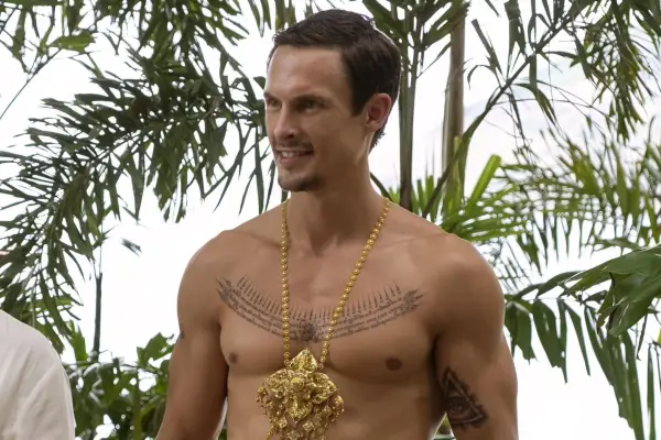 Arnas Fedaravičius stars in The White Lotus season 3 wearing a gold chain