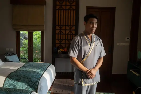 Dom Hetrakul stars in The White Lotus season 3 in a bedroom