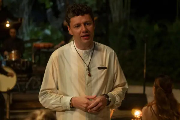 Christian Friedel stars in The White Lotus season 3 in a stripy shirt