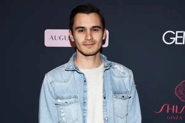 Julian Kostov in a denim shirt