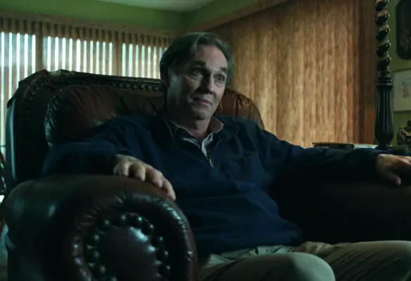 Nathan Davis sitting in a chair in Ozark