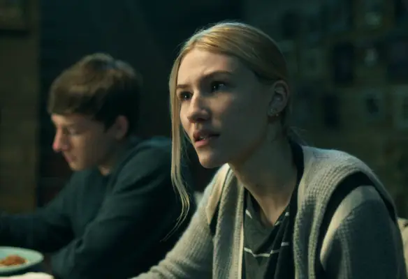 Sofia Hublitz as Charlotte Byrde looking shocked in Ozark while eating dinner with family