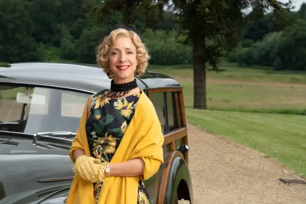 Mrs Devine (Claudie Blakley) in Father Brown in a yellow dress