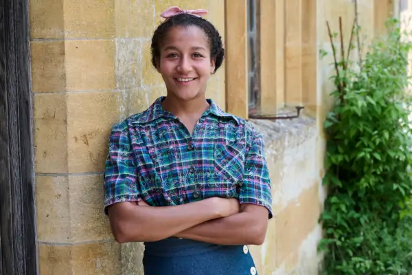 Ruby-May Martinwood as Brenda Palmer in Father Brown, leaning against a wall