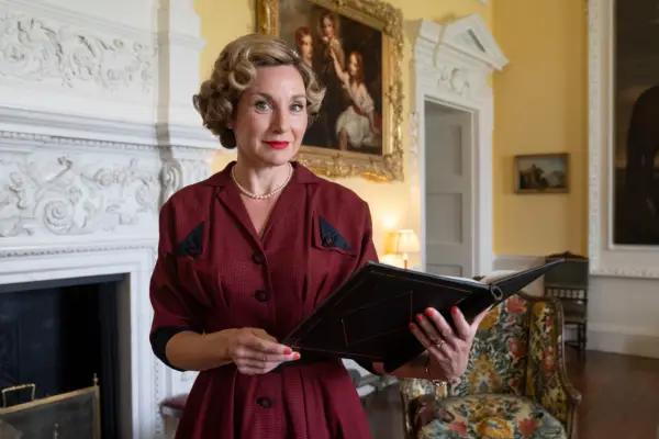 Nancy Carroll as Lady Felicia in Father Brown, holding a folder