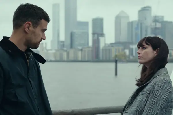 The Gentlemen still showing two characters looking at each other with a city skyline in the background