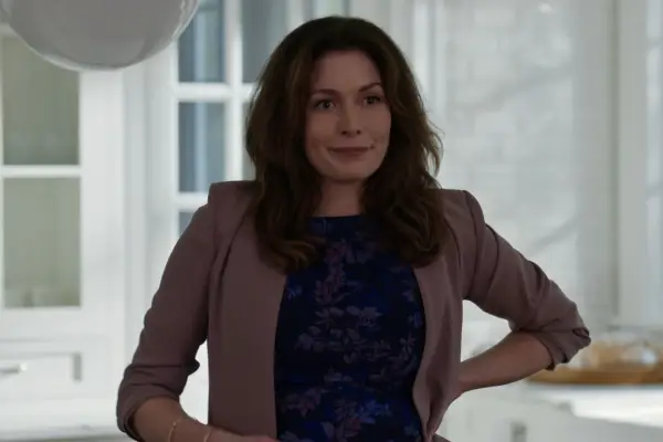 Lauren Hammersley as Charmaine Roberts in Virgin River in a blazer with hand on hip