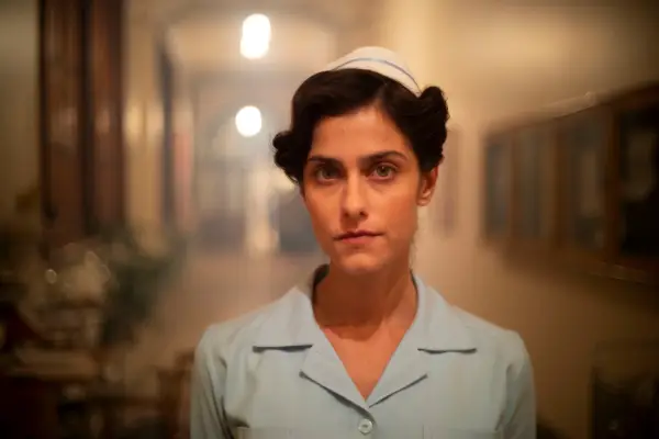 Lois Bennett (Julia Brown) in World on Fire, wearing 1940s uniform