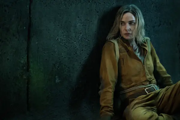 Rebecca Ferguson in Silo season 2 sitting in a brown jumpsuit