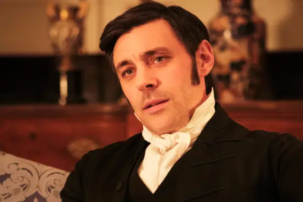 Samuel Colbourne sat on a sofa