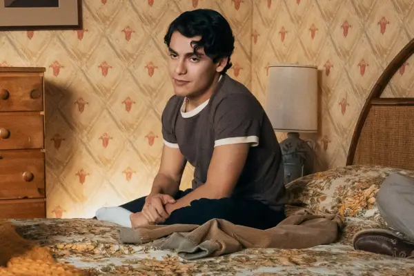 Dixon sat on the edge of the bed