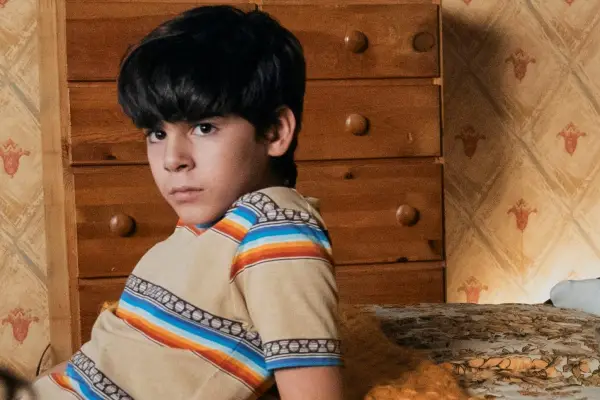 Ozzy leaning on a bed