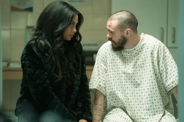 Yasmin Seky as Nikita Murphy, sat next to Viking on a hospital bed. they