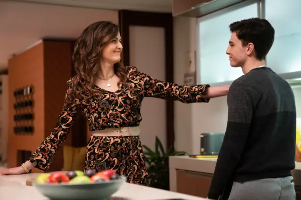 Cian Fitzsimons as Jamie Kinsella, standing in the kitchen with his mum, who has her arm on his shoulder