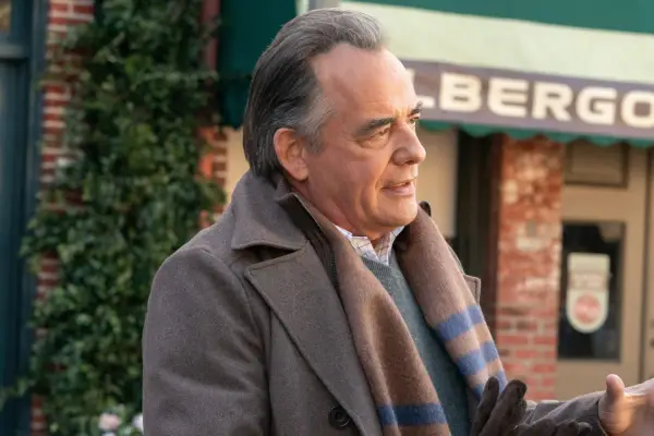 Alison sat at the anchor desk with the morning show logo behind her