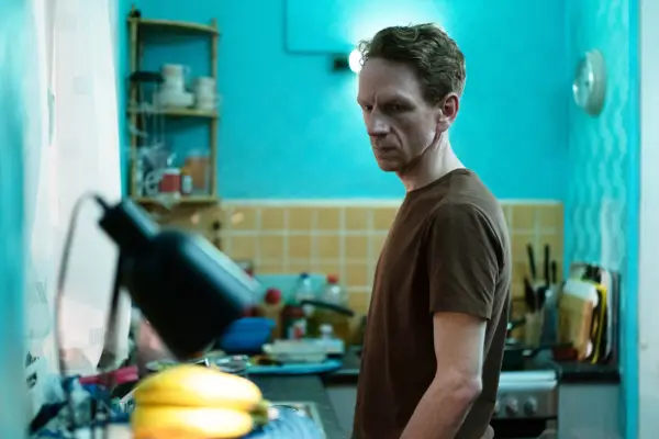 Michael standing in his kitchen