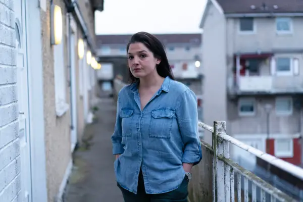 Chrissie standing outside her flat